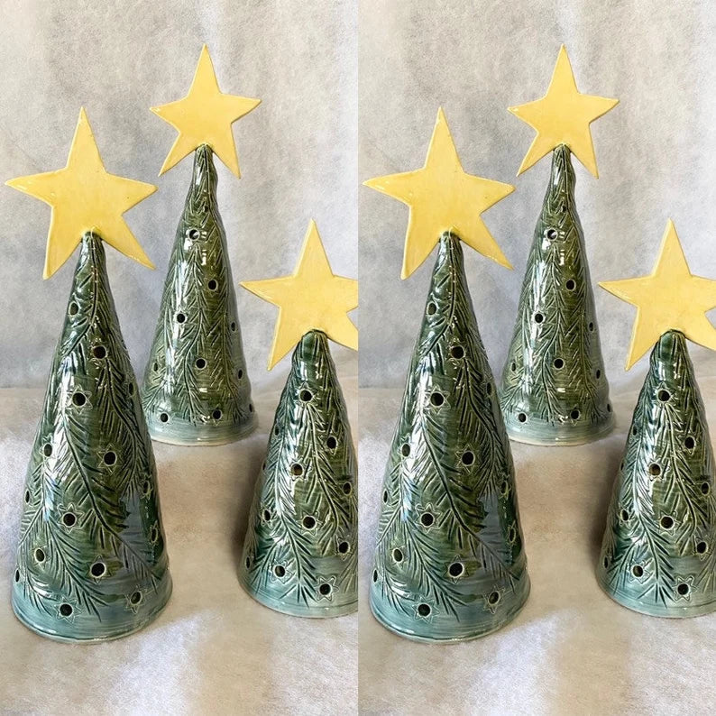 Designs by Katie - Some hand painted ceramic Christmas trees that light up.  These will be available to purchase November 17th at the @localsellermarket  !!